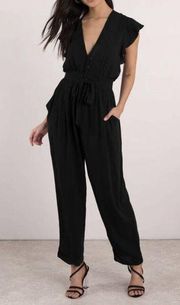 Free People  Ruffle Your Feather One-Piece Black Jumpsuit Deep V Neck size M