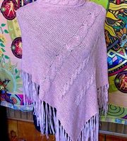 Woman’s small pink sweater poncho