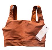 NWT- UNDERWOOD-SIZE XS Gorgeous rust color sports bra with a little shimmer, brand new with tags, size xs   Bust measures 14 inches armpit to armpit