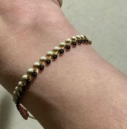 Stella & Dot pulley reversible bracelet orange black white gold EUC