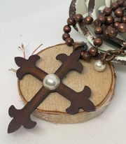 Copper ball chain with metal cross and a Pearl bead in the center.