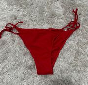 Red cheeky swim bottoms