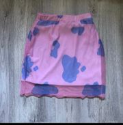 x dolls kill pink and purple cow print mesh mini skirt