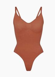 SKIMS sculpting thong body suit