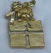 American Jewelry Co. puppy peeping from package brooch.