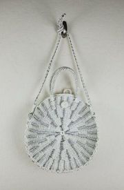Mudpie white w/silver wicker handbag has a shoulder strap and handles used 1x
