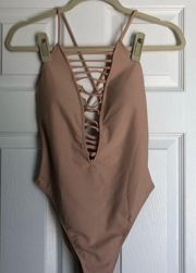 nude strappy one-piece swimsuit