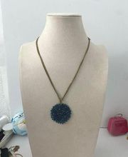 Vintage Kenneth Cole sparkly blue glass round pendant necklace