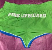EUC-Love Pink Green running shorts with pockets and inside lining.