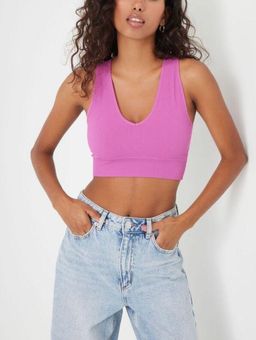 Garage stella seamless plunge tank Pink - $11 (56% Off Retail) - From  Kadence