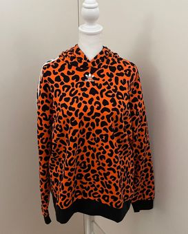 adidas Originals x Rich Mnisi all over leopard print legging in orange