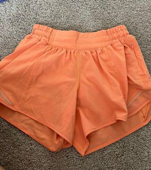 4” lululemon neon orange hotty hot shorts