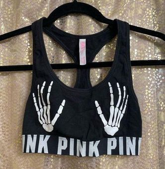 Pink skeleton hands sports bra