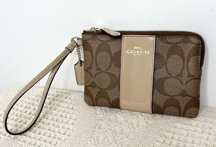 Buy the Coach Signature Corner Zip Wristlet Brown