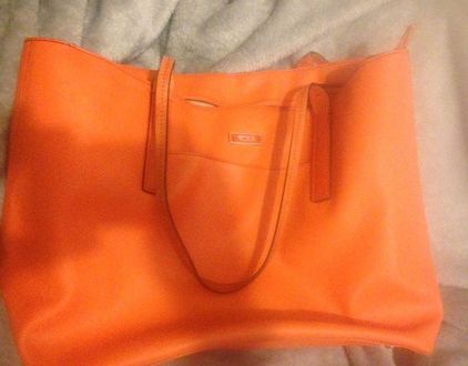tumi orange bag
