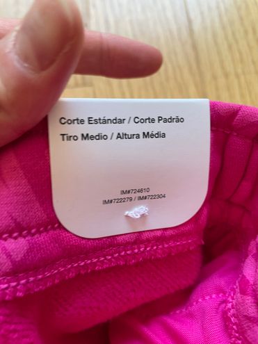 Nike Monogram All Over Logo Print Fleece Cuffed Sweatpants in Pink