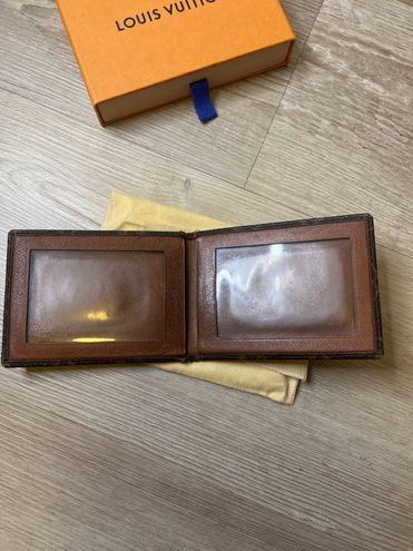 Louis Vuitton compact wallet from seller “Jerseyland020”. Took 21 days to  receive in the U.S., cost $27.76. Has a soft outside touch with  rough/strong inside feel. Nice stitching and know it'll last