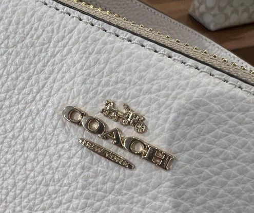 COACH Outlet Nolita 19 In Signature Canvas With Floral Whipstitch 228.00