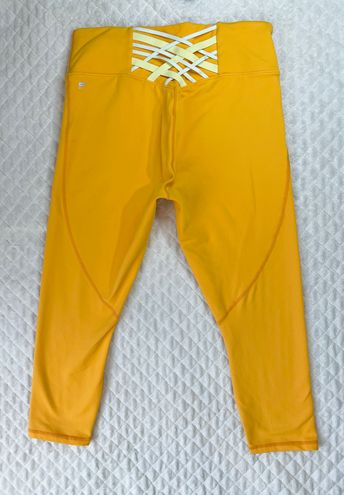 Fabletics Powerhold Leggings Size XL Pants Solid Yellow Lace up Back Capri  STAIN - $20 (75% Off Retail) - From Deana