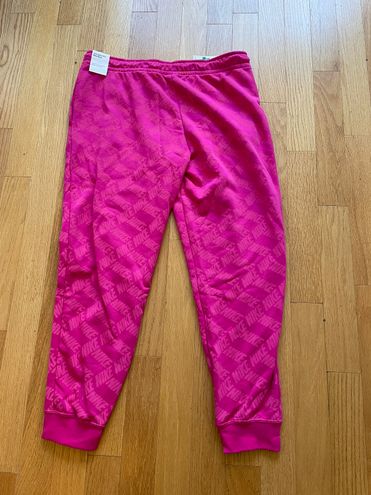 Nike Monogram All Over Logo Print Fleece Cuffed Sweatpants in Pink