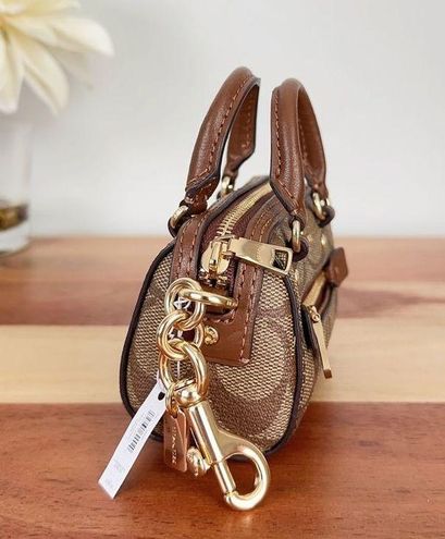 COACH Mini Rowan Satchel Bag Charm With Dandelion  Satchel bags, Pink  leather wallet, Brown leather shoulder bag