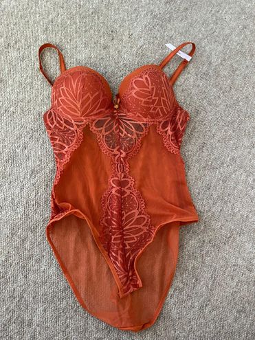 Daisy Fuentes burnt orange bodysuit - $21 - From olivia