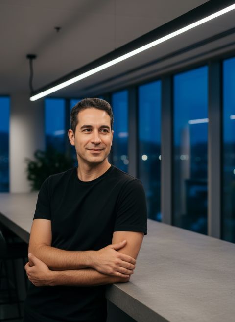 Realistic office portrait person in black t-shirt soft smile