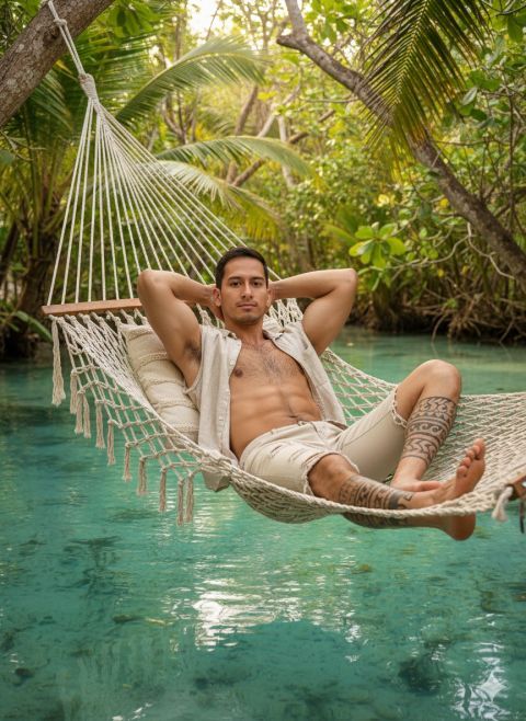Realistic 8K photo man relaxing tropical lagoon hammock