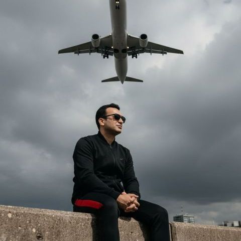 Cinematic portrait young man low angle airplane 8k