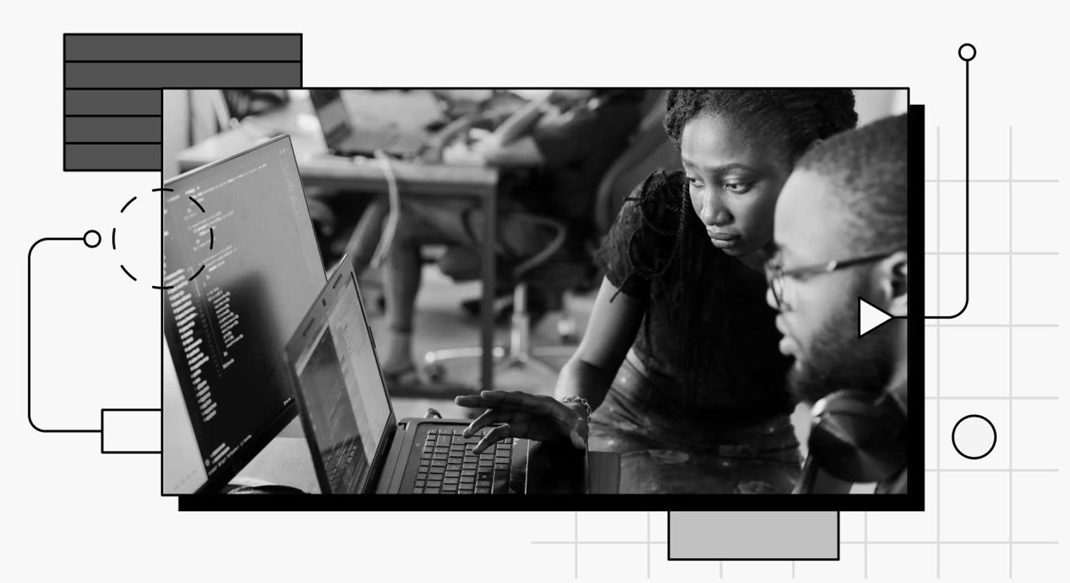 Two people looking at a laptop.