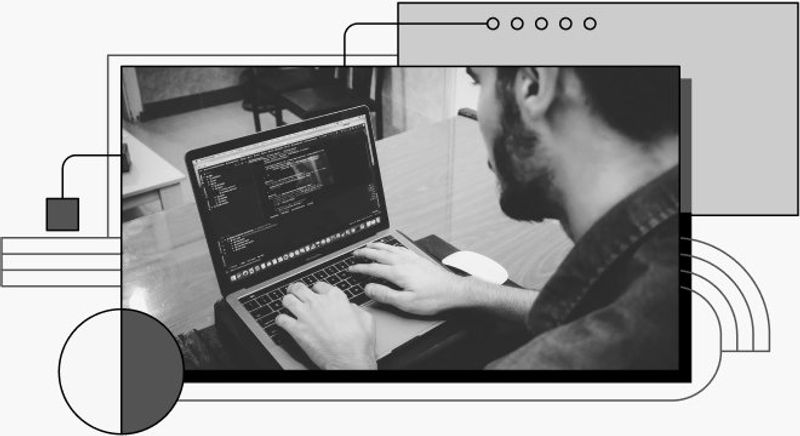 Photo of a person coding in their laptop.