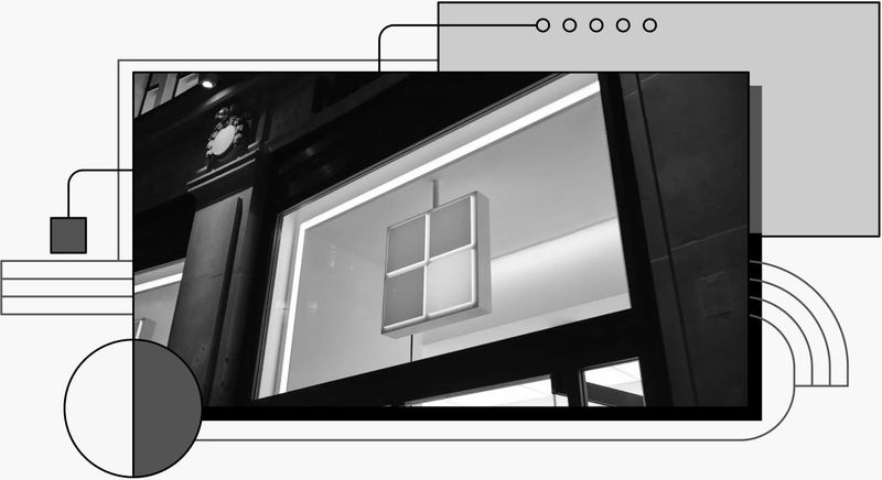 Photo of the Microsoft logo in a big screen.