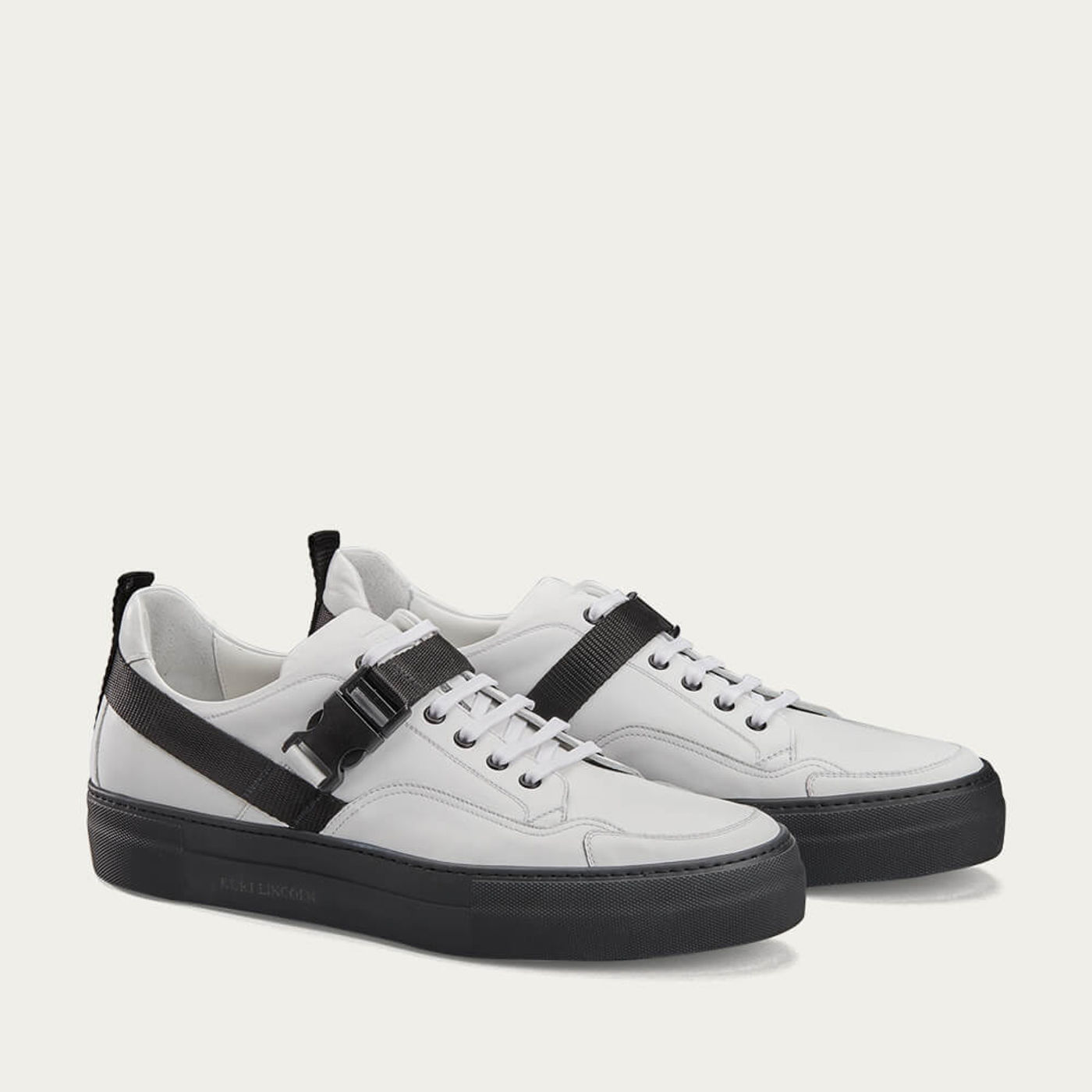 White and Black Low Top Sneakers With Strap | Bombinate