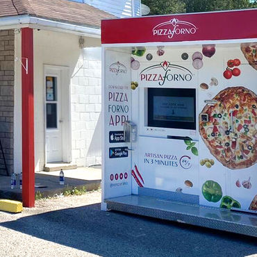 An outdoor PizzaForno kiosk that is located beside a general store