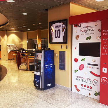 An indoor pizza vending machine located inside a medical building.