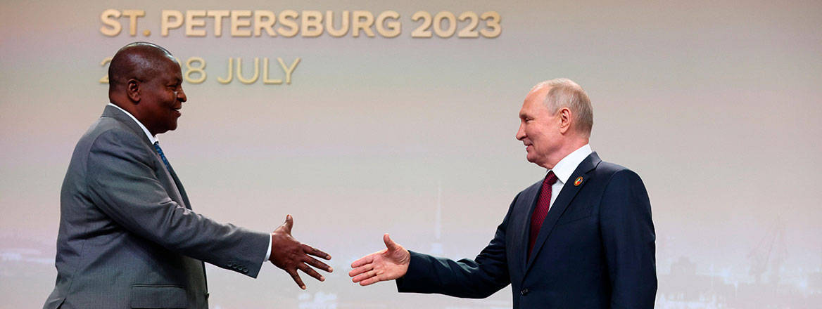 Faustin-Archange Touadéra (left) about to shake hands with Vladimir Putin (right)