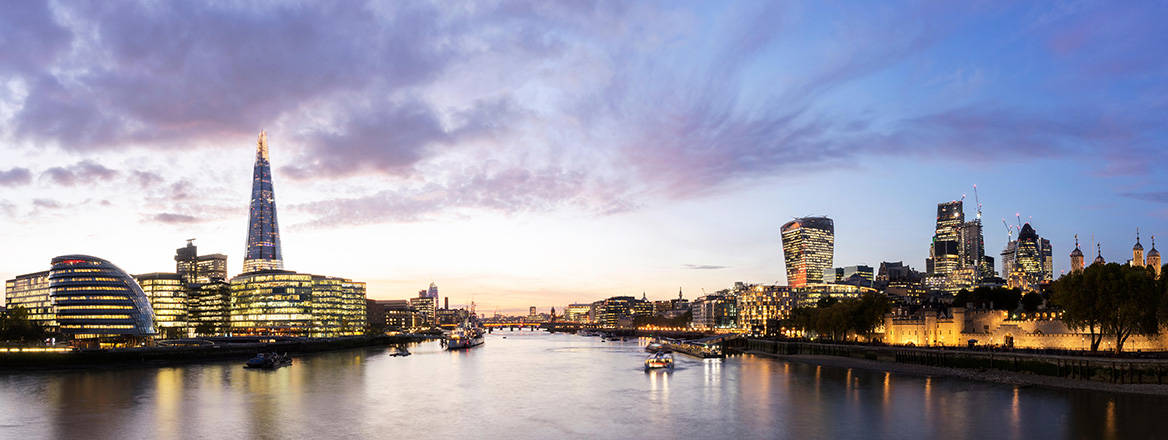 London city skyline and river at dusk