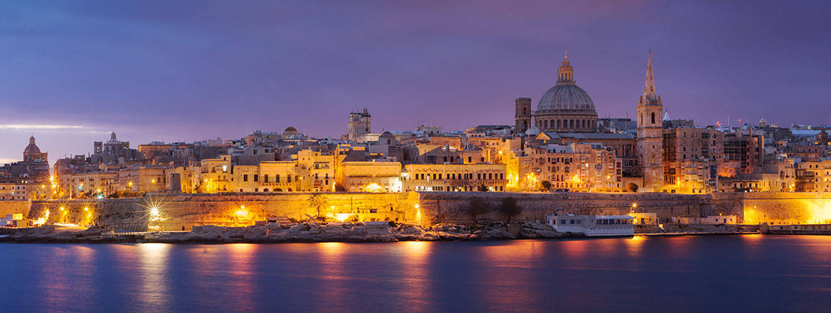 Panoramic view of Valletta at night.