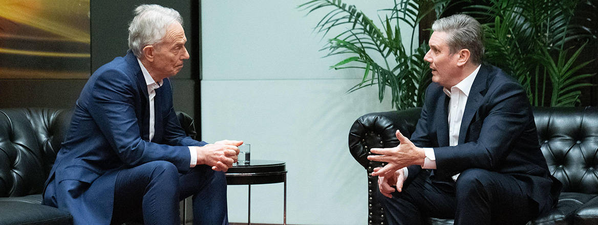 Former UK Prime Minister Tony Blair, who led the UK as the decisions to invade Iraq and Afghanistan were made, sits in discussion with current UK Prime Minister Keir Starmer.