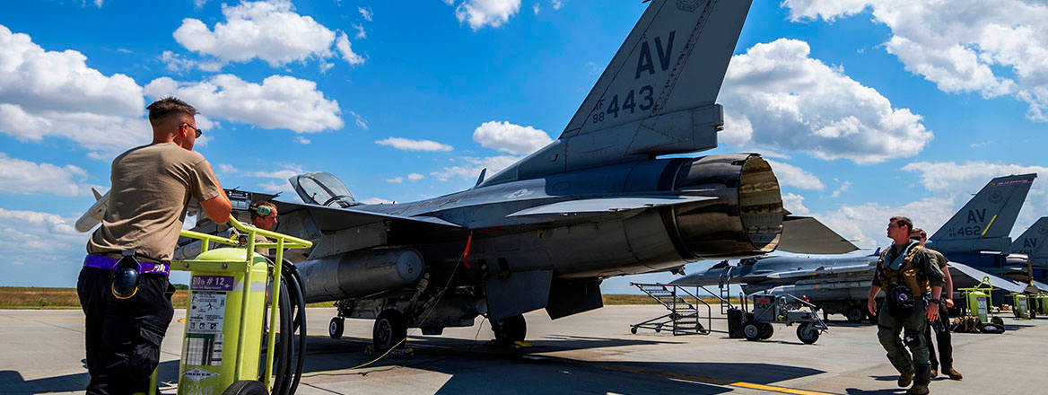 Pre-flight checks on an F16 Fighting Falcon at a Romanian airbase