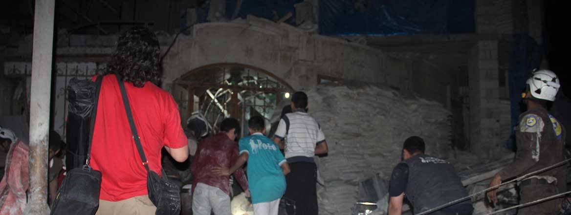 A night scene with many people and rubble