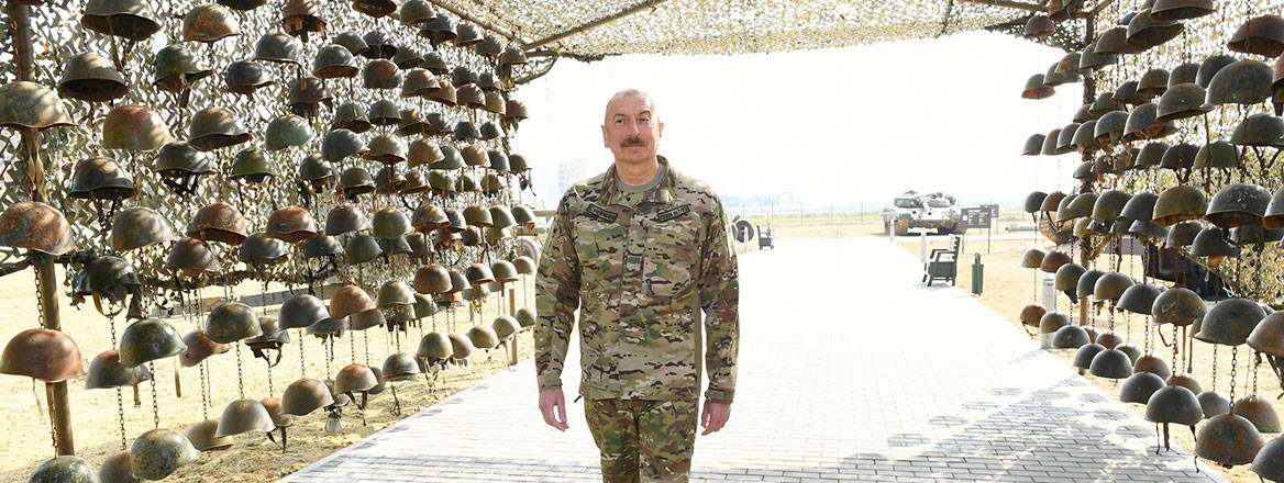 Victory march: Azerbaijani President Ilham Aliyev at an exhibit of defeated Armenian soldiers' helmets in Baku