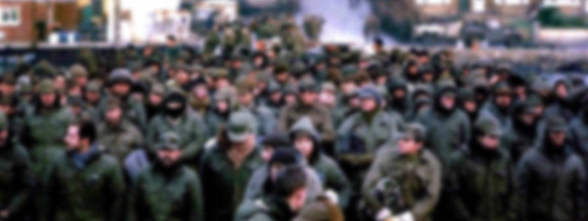 A very large group of Argentine POWs in uniform. Their faces are blurred.