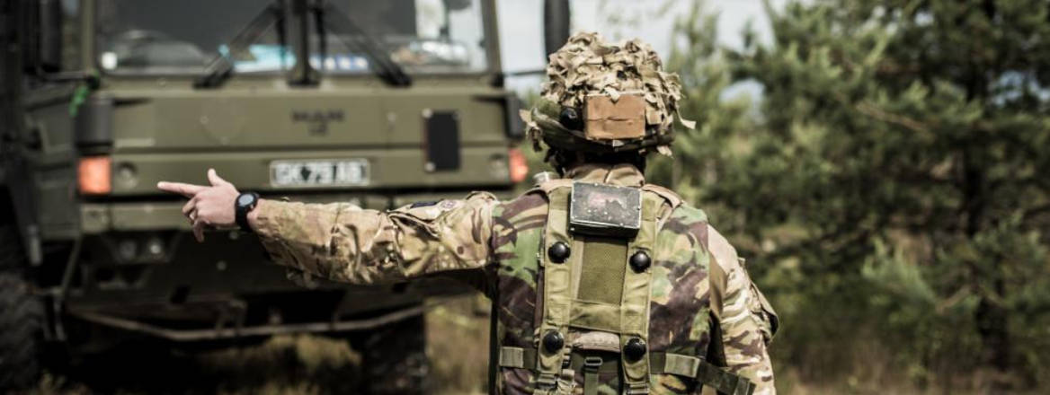A British Army soldier directing a vehicle during a training exercise. Courtesy of US Army Europe / flickr.