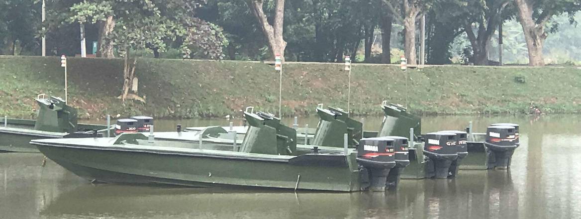 Three Arrow-class patrol boats sitting in calm water