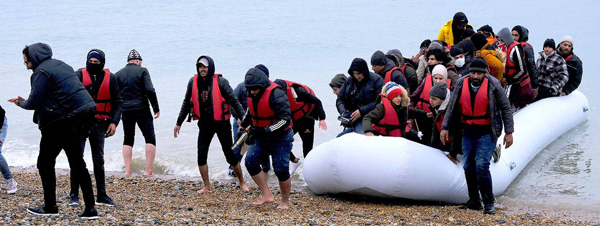 Migrants land on a beach in Dungeness, UK on 24 November 2021