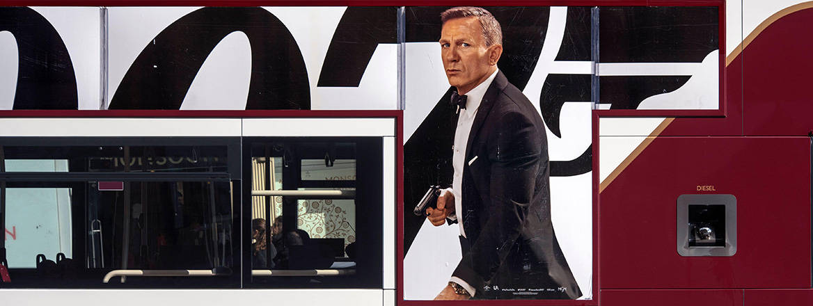 Daniel Craig as James Bond pictured on the side of a bus in Edinburgh, Scotland, UK