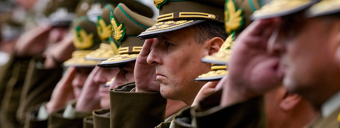 Paying respects: Chilean police officers salute at the funeral of a fallen colleague who was killed off-duty in April 2024