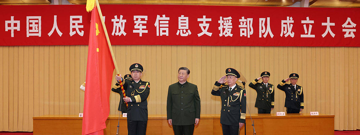 Military officers at a ceremony with the Chinese flag displayed