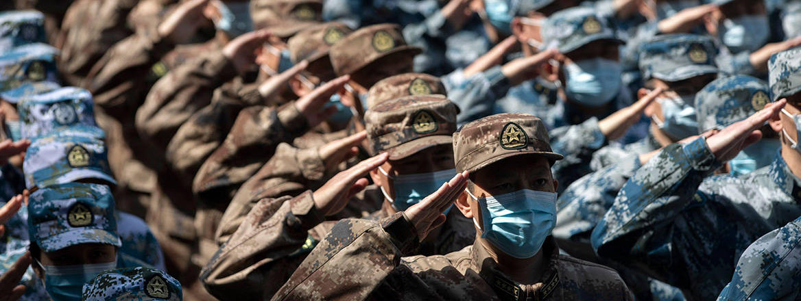 Military medics salute outside the Huoshenshan Hospital in Wuhan, China in April 2020. Courtesy of Fei Maohua / Alamy Live News